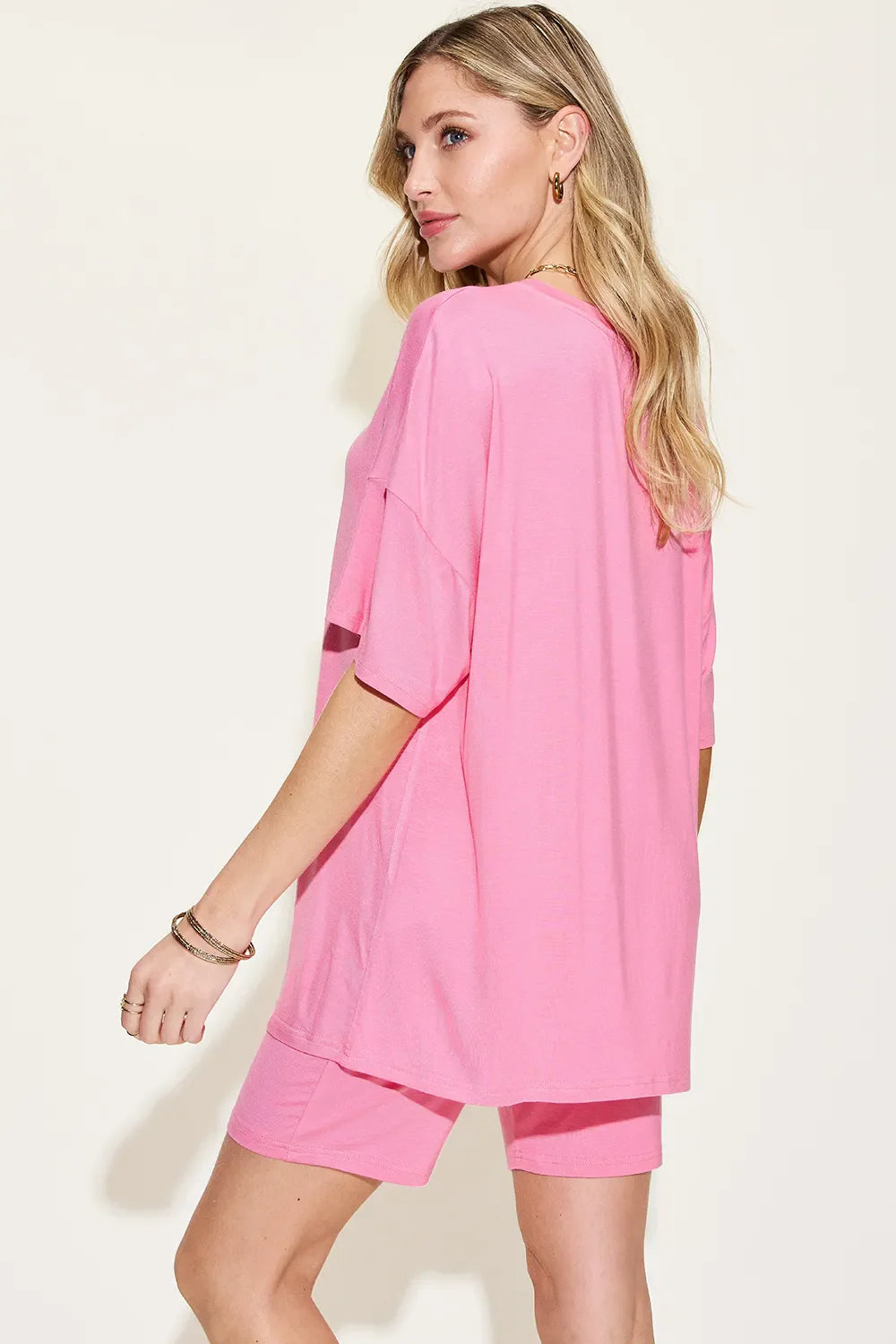 Pink back view lounge set: drapey drop-shoulder V-neck t-shirt with matching shorts